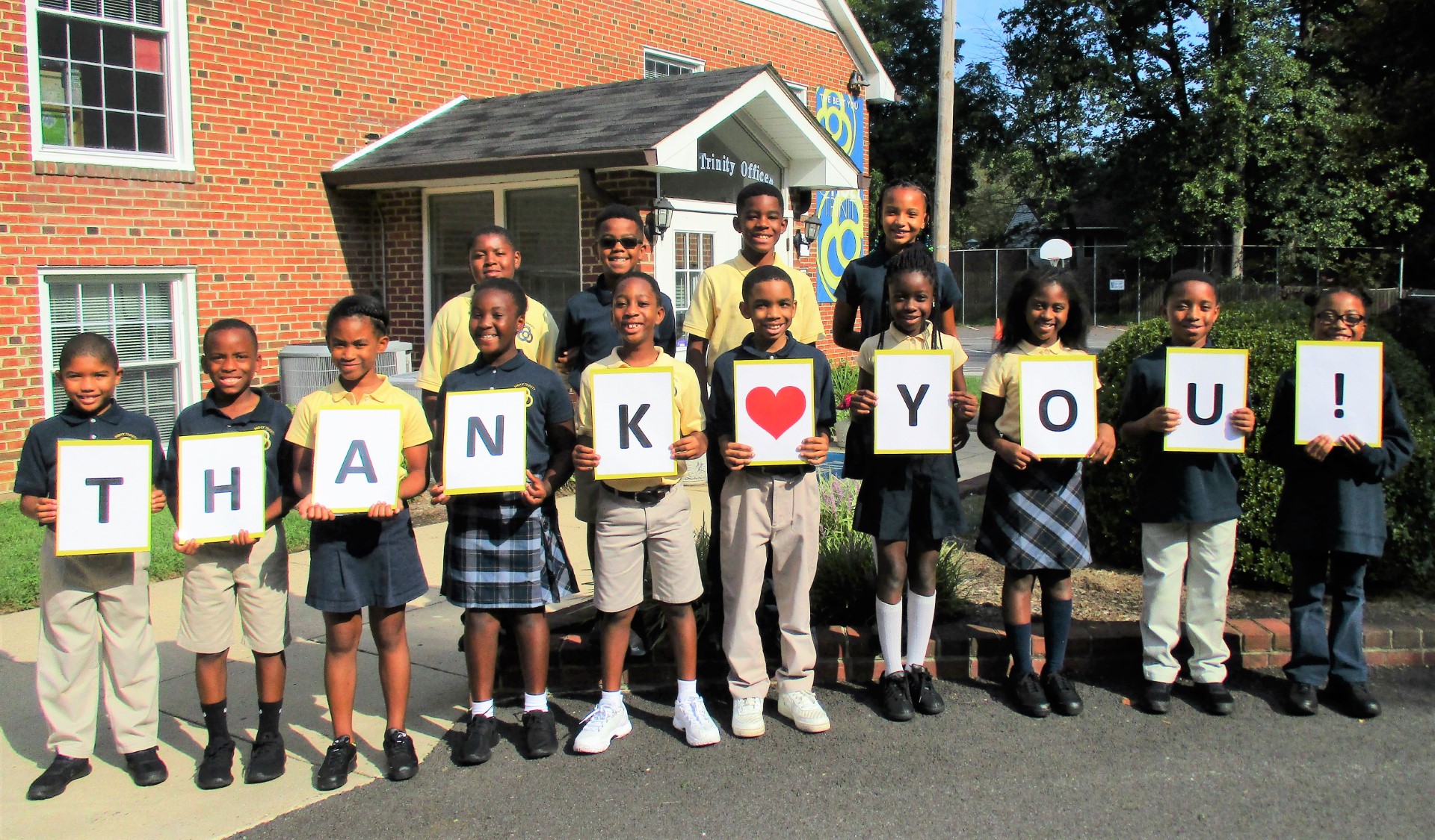 Students holding letters that spell out Thank you!